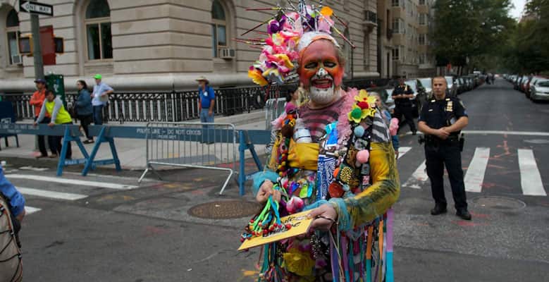 Man dressed as a clown in the street